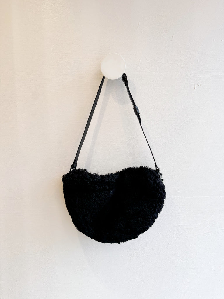 Black shearling sling