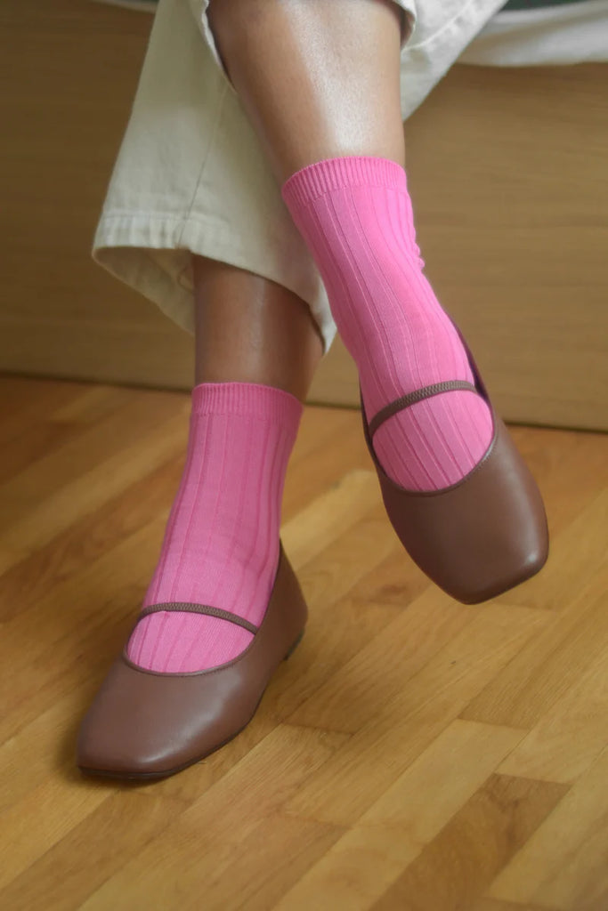 HER socks in bright pink