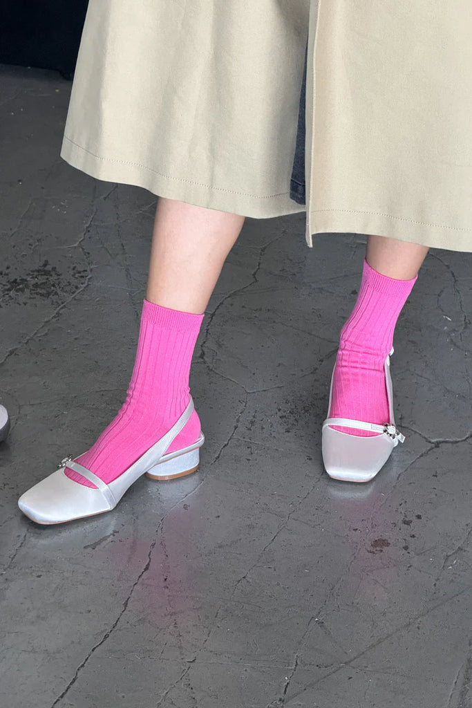 HER socks in bright pink